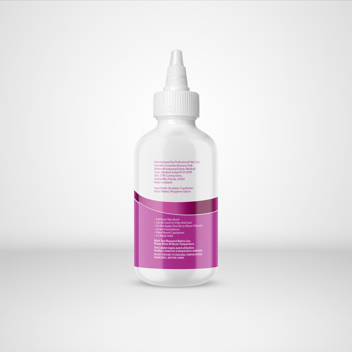 White bottle with a purple label on a light gray background