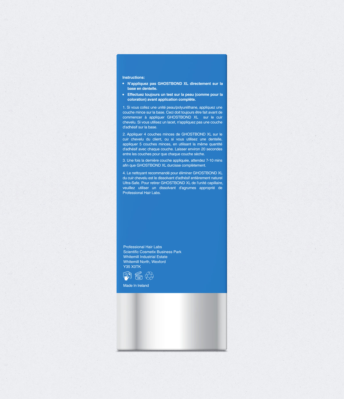 Hair care product packaging with blue label and silver base on a light gray background
