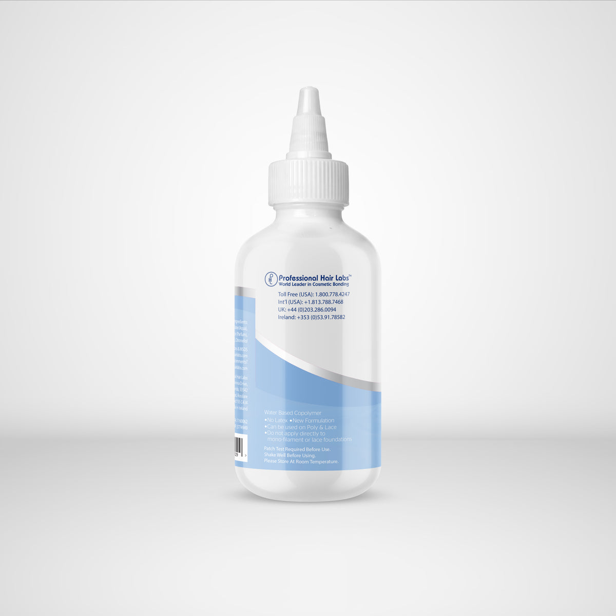 Bottle of professional hair lather on a white background