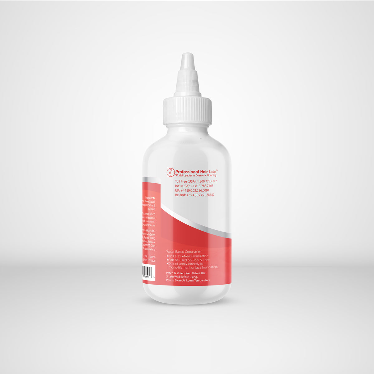 White bottle with a red label on a light gray background